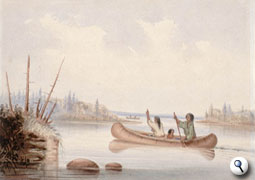 Natives paddling a canoe