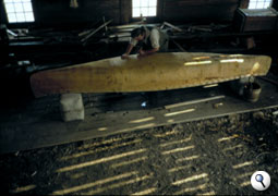 Working on a canoe, Fort William Historical Park
